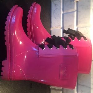 Valentino Red rain boots with black bows.